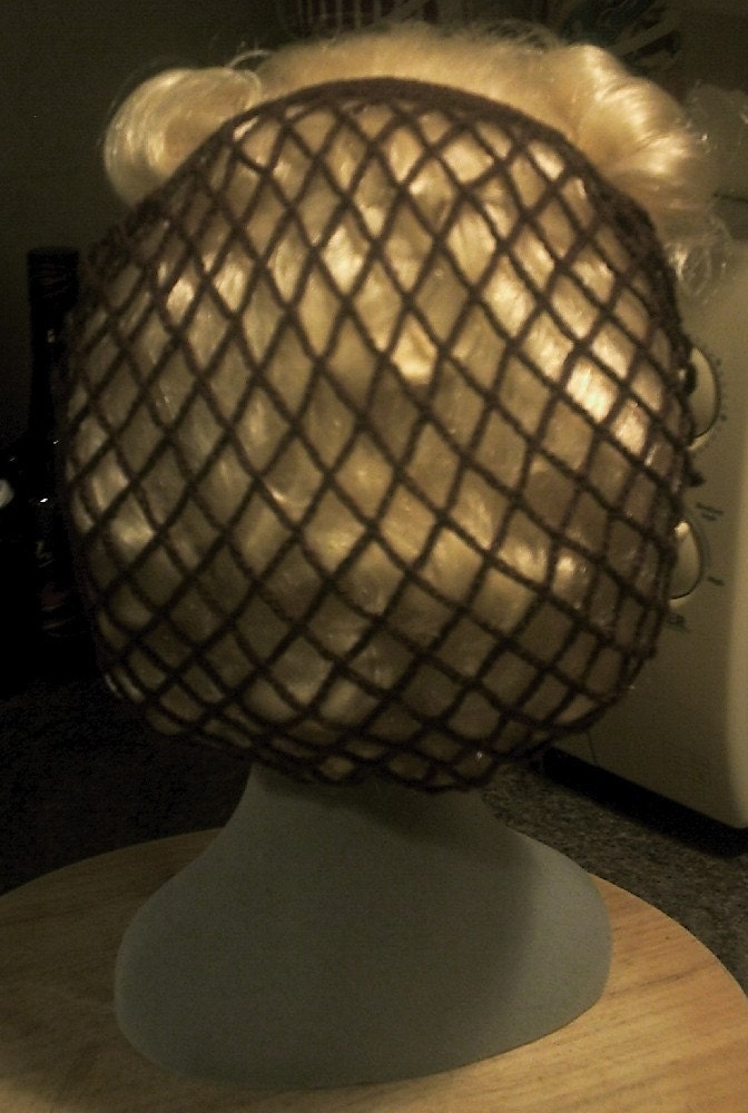 Brown snood/hairnet crocheted to an original 1940s design.