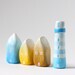 Three little ombré clay houses and a striped lighthouse - light blue, yellow, ochre, white