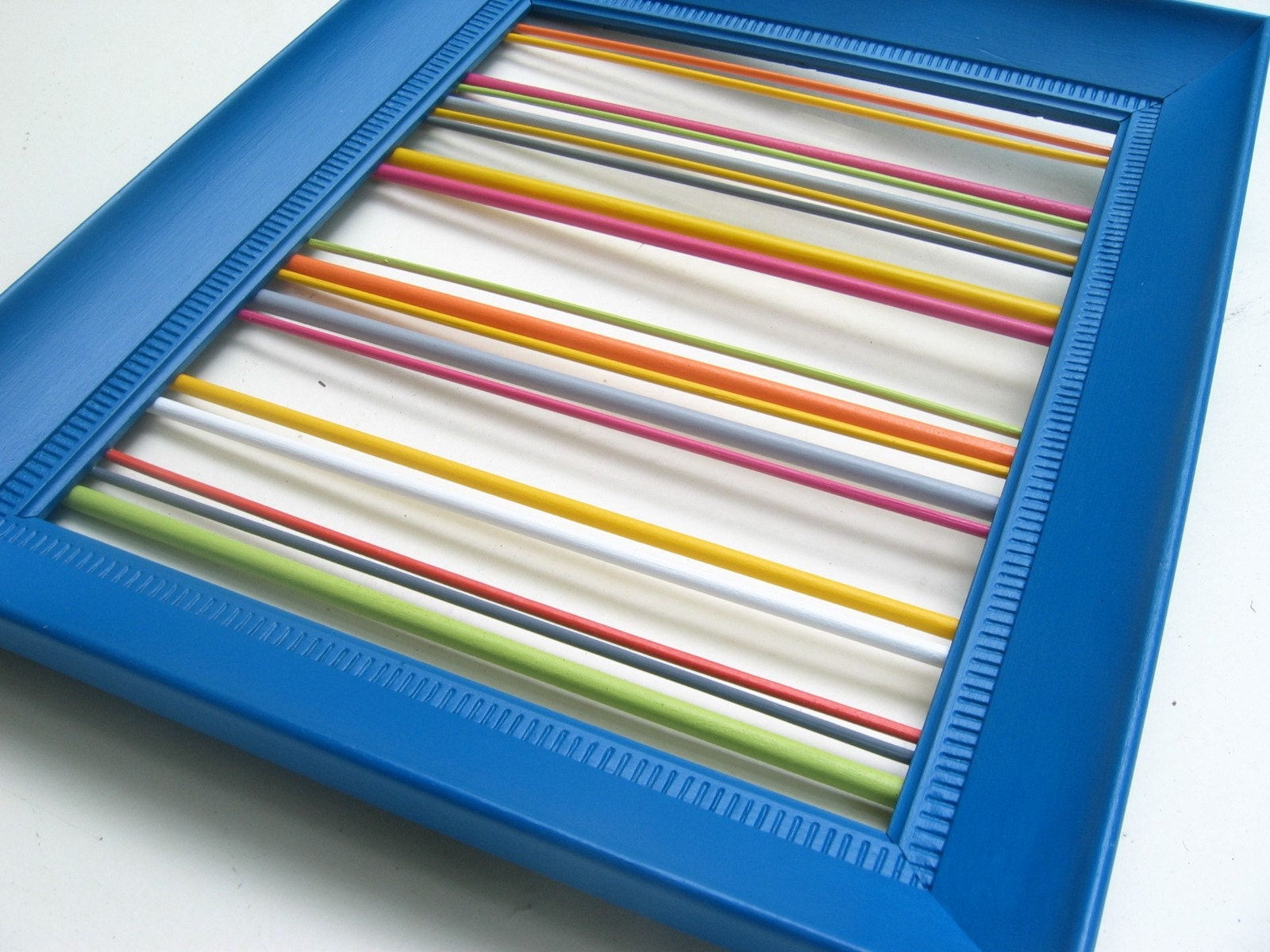 modern wall hanging / sculpture / assemblage - electric blue frame with bright multi-color round rods