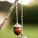 3 sets of golden acorns . ornaments