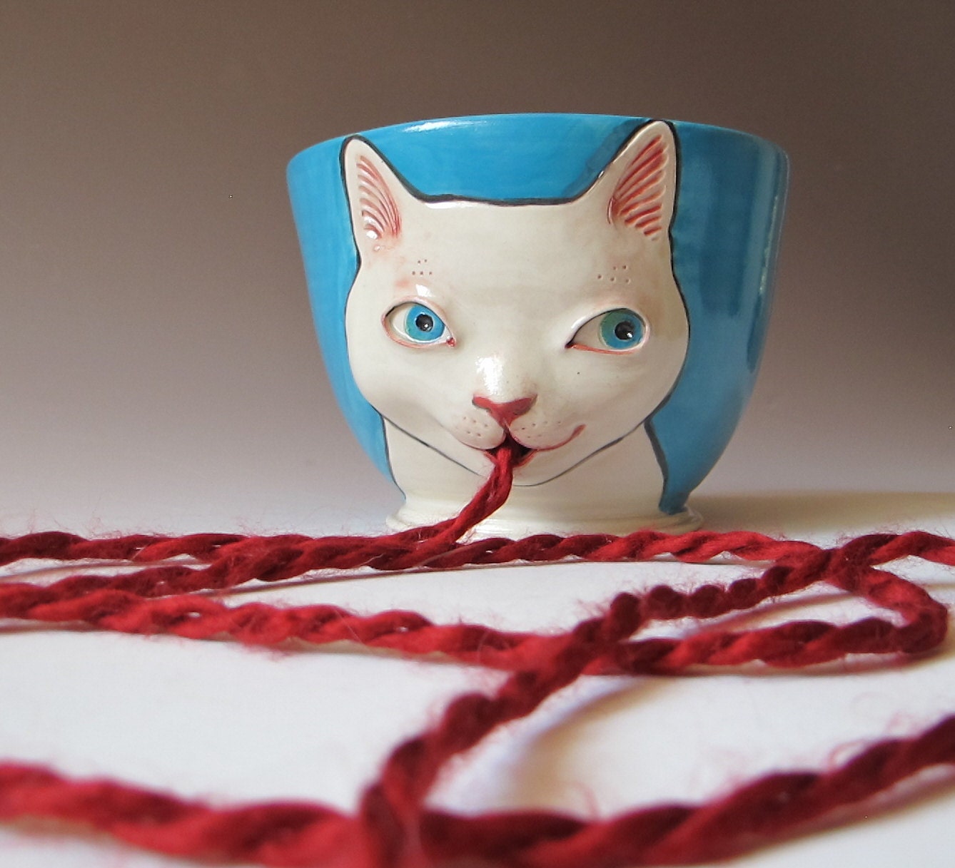 White Cat Yarn Bowl - sculpted kitty against Turquoise Background