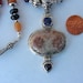 Lolite garnet fossil necklace beautiful pendant all sterling silver comes in a tarnish r pouch