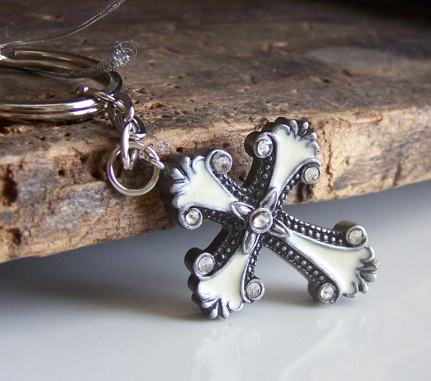 DOLLAR DAZE REDUCED Plastic Cream and Silver Cross Trinket