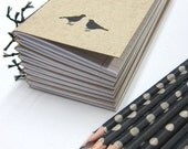 Notebook  with Two Birds and a Pencil