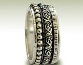 Sterling silver meditation ring with detailed silver stacking spinner bands - Wait for the sound.
