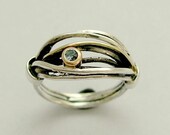 Sterling silver wrapped band mixed gold with a blue topaz  gemstone - Love is found.