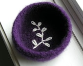 Felted wool bowl with an embroidered fern silhouette in the bottom