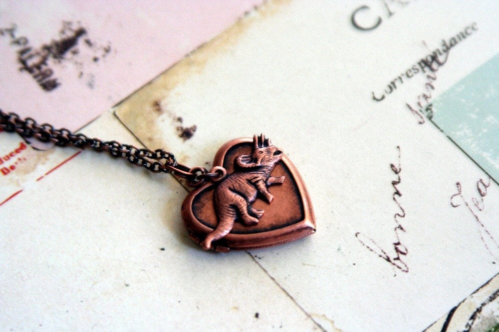 triceratops locket necklace. copper ox
