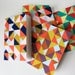 triangle jotter ... with navy, orange, and pink