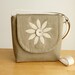 A Cross Body Satchel in Sandstone Linen with a Handmade Flower Applique