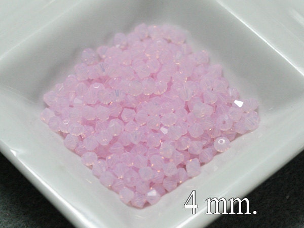 100 pcs. Rose Water Opal Swarovski Crystal Bicone 4 mm.