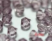 100 pcs. Swarovski Crystal Bicone Light Amethyst 4 mm.