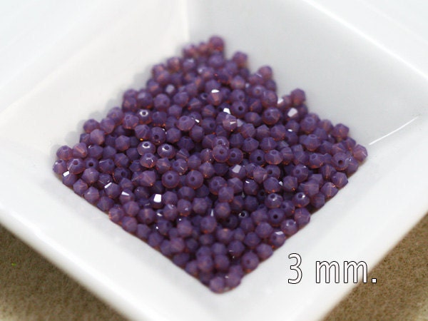 50 pcs. Cyclamen Opal Swarovski Crystal Bicone 3 mm.