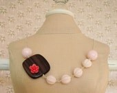 Trinket . Polished Ebony, Tiny Flower, and Pale Pink Beads