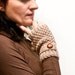 Knit fingerless gloves , mittens in beige with a strap