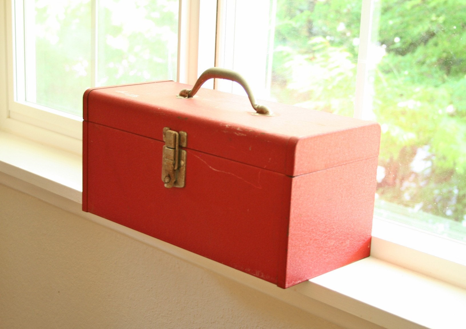vintage metal tool box in red