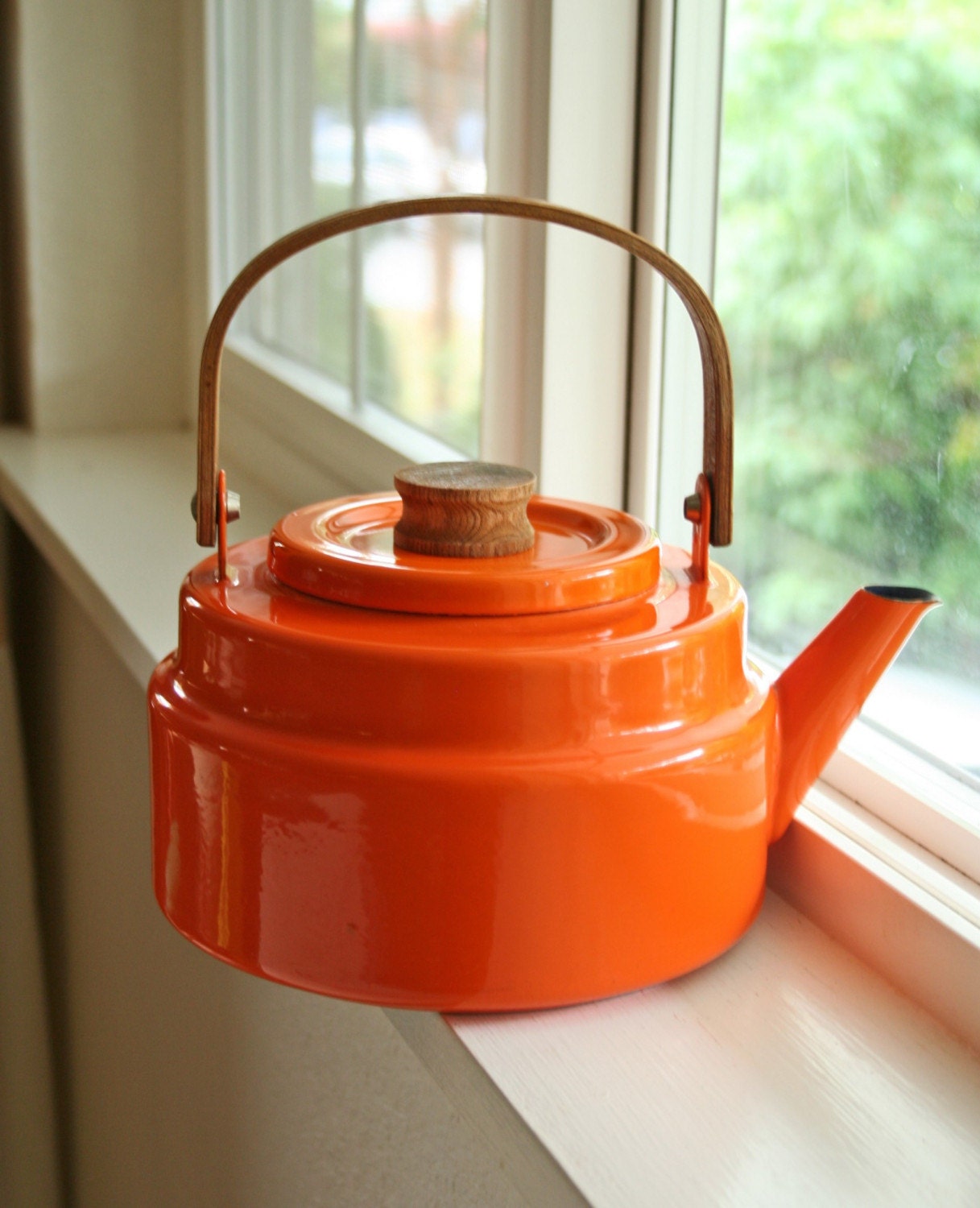 orange enamelware tea kettle with wooden handle by ModishVintage