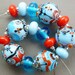 Lipstick and lashes...... Lampwork bead set by Pixie Willow Designs