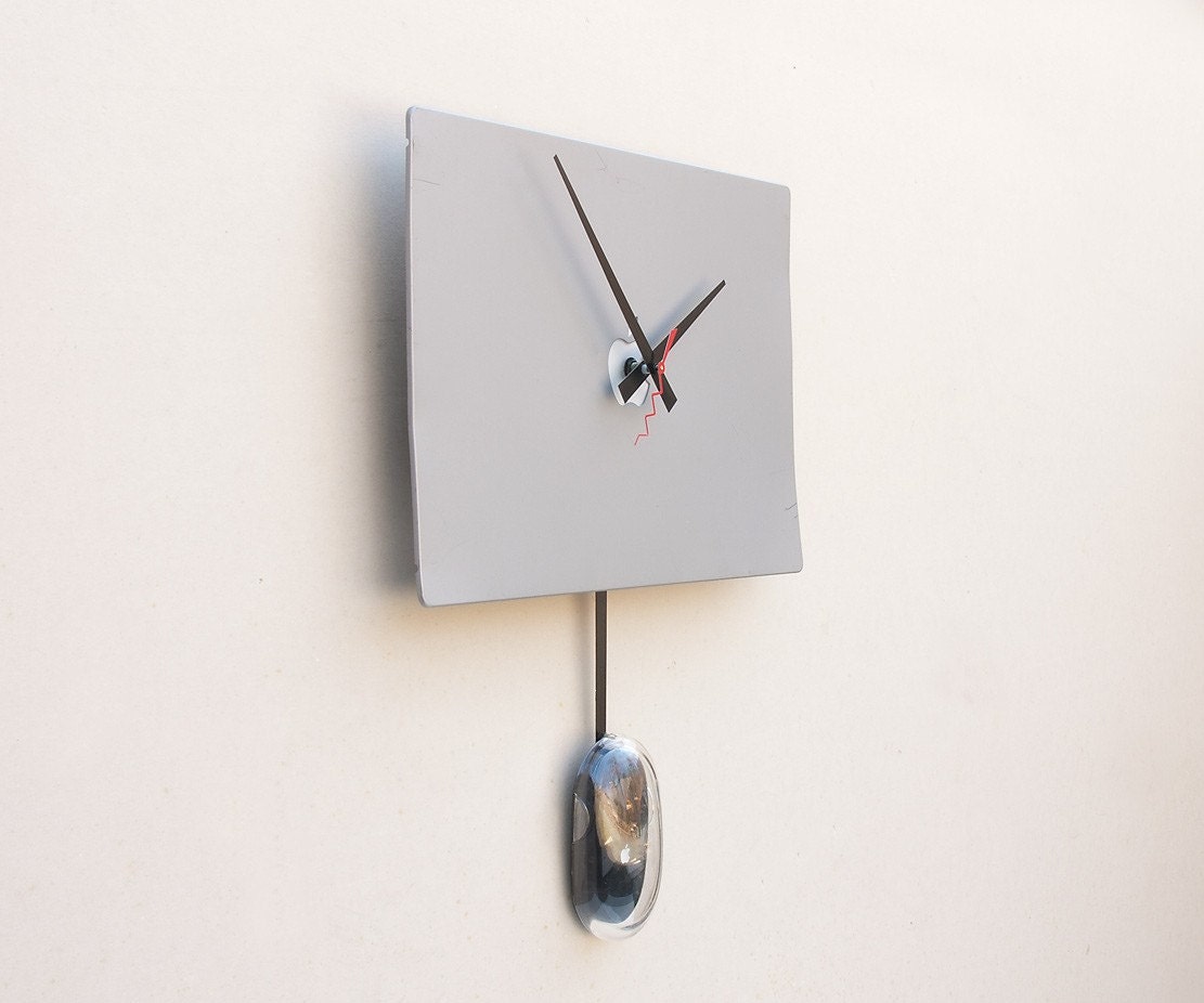 Clock created from a recycled Apple Powerbook laptop cover