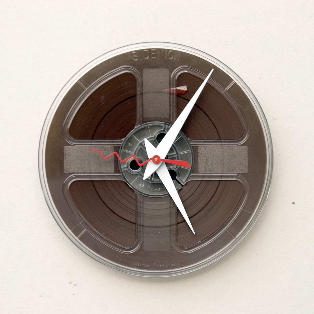 clock made from a recycled magnetic tape reel