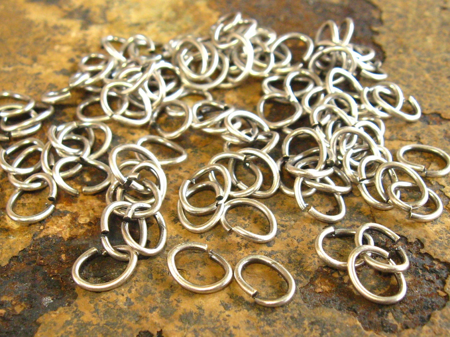 LOW SHIPPING 50 Antique Silver 7mm  x 5mm Oval 20 Gauge Jumprings -  Trinity Brass