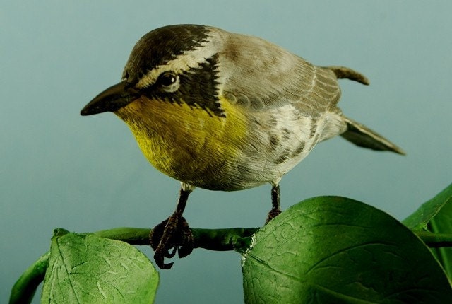Wood Carving of a Yellow-Breasted Warbler