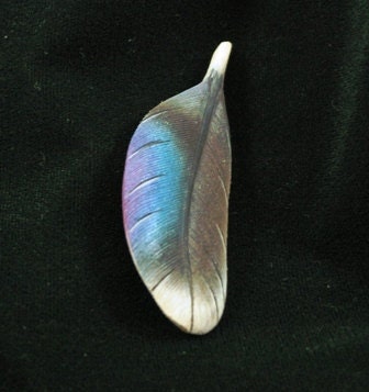 Wood carving of a Mallard Drake feather pin
