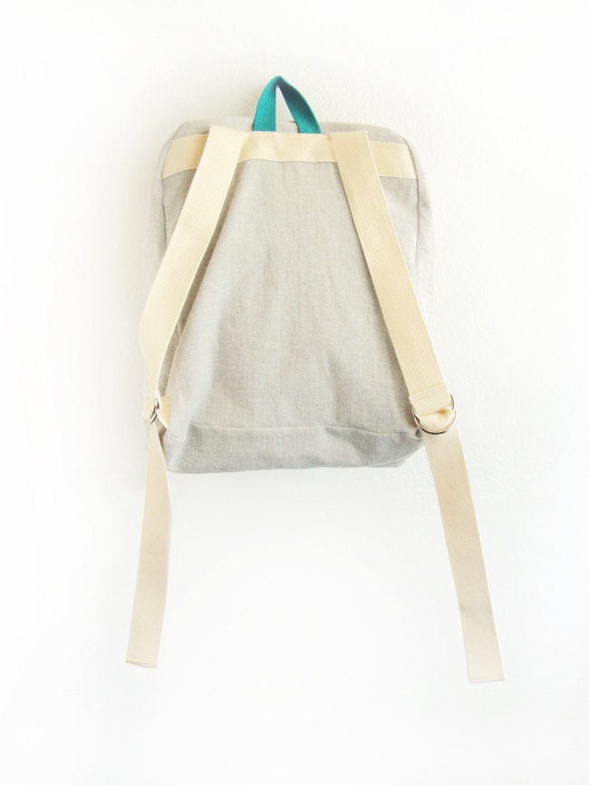 light grey denim backpack with magenta pouch