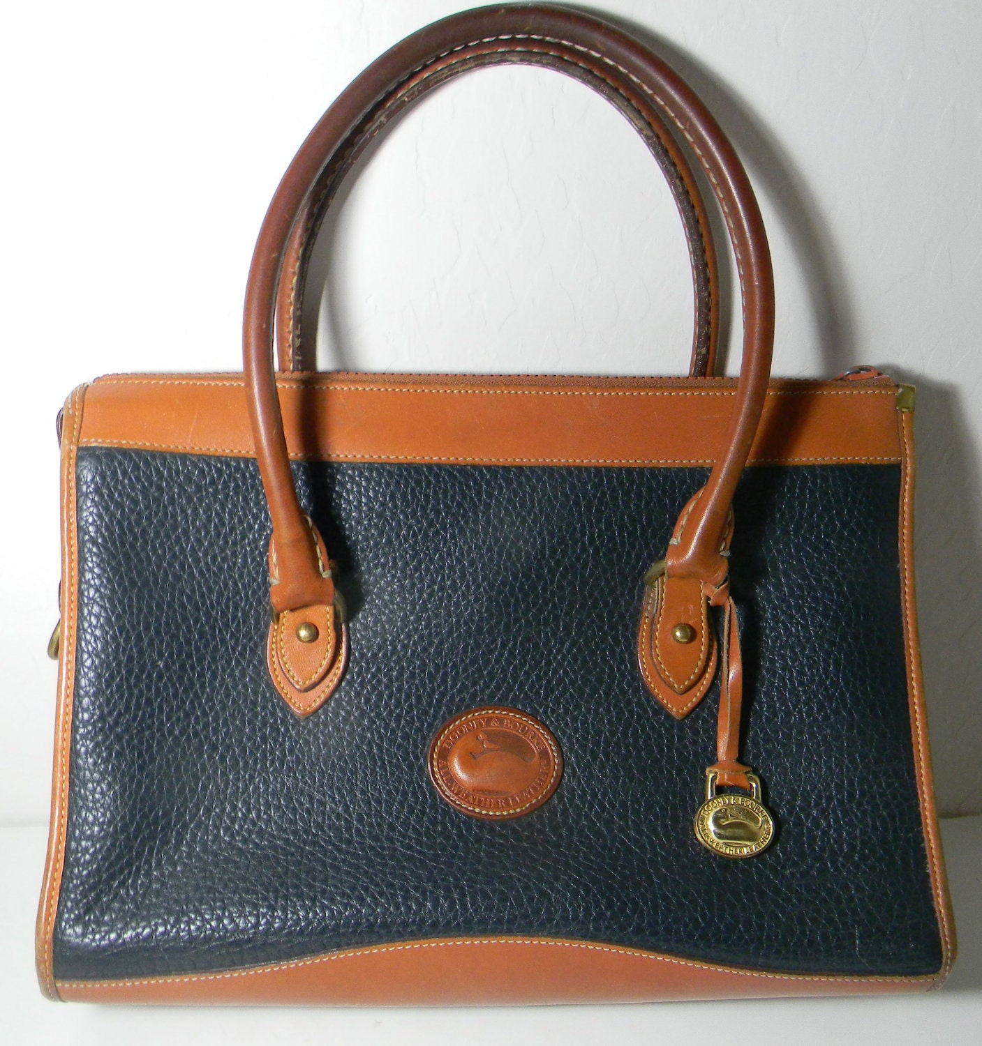 Vintage Dooney and Burke All Weather bag - pebbled leather in Navy with tan trim