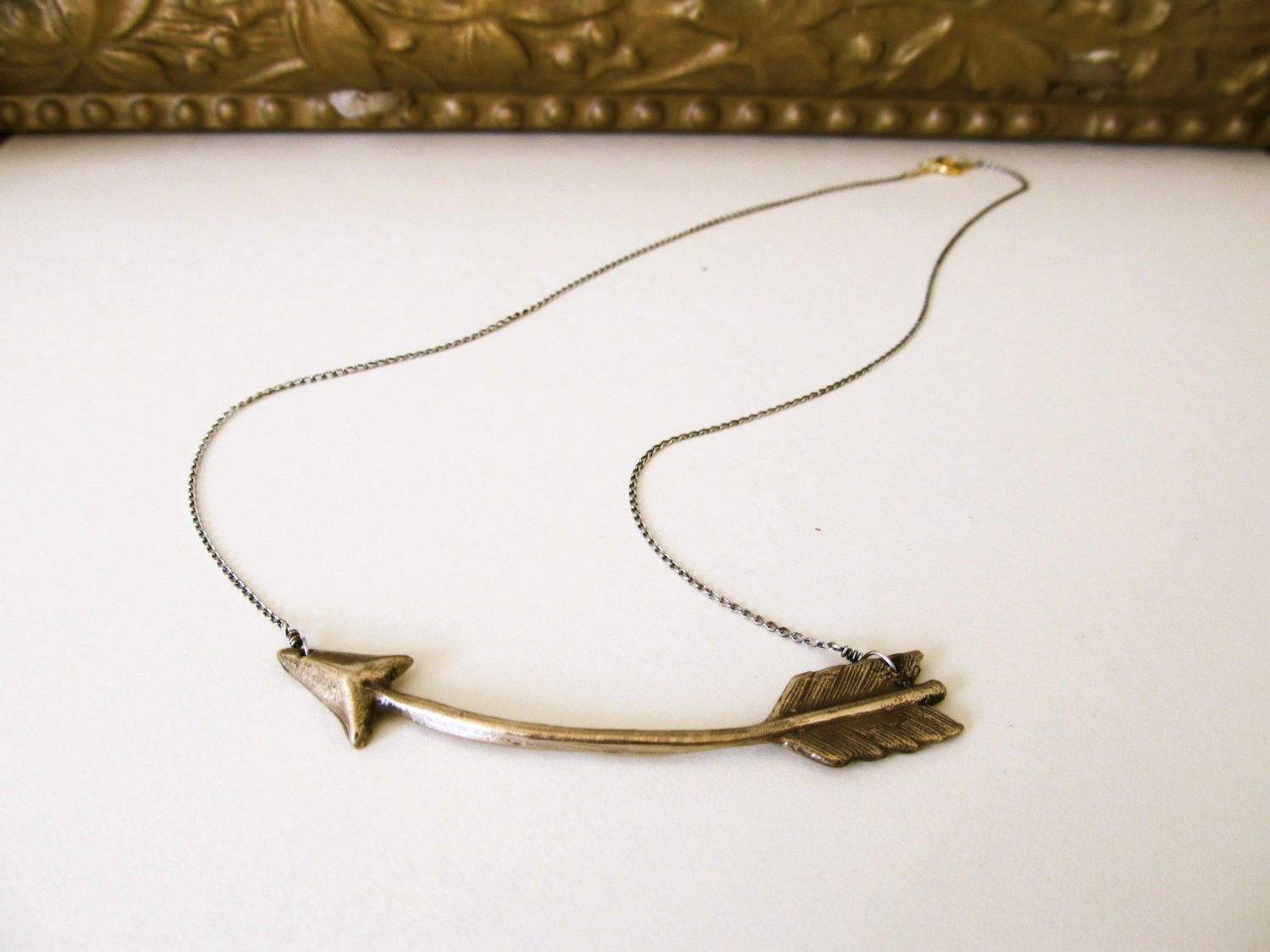 Shot Through the Heart Arrow Necklace in Bronze