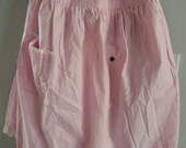 Vintage pale pink apron with white scallop trim