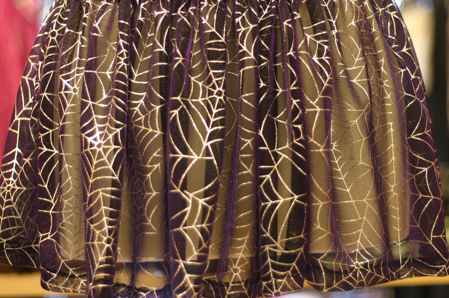 Spooky spiderweb skirt with silver webs on purple mesh