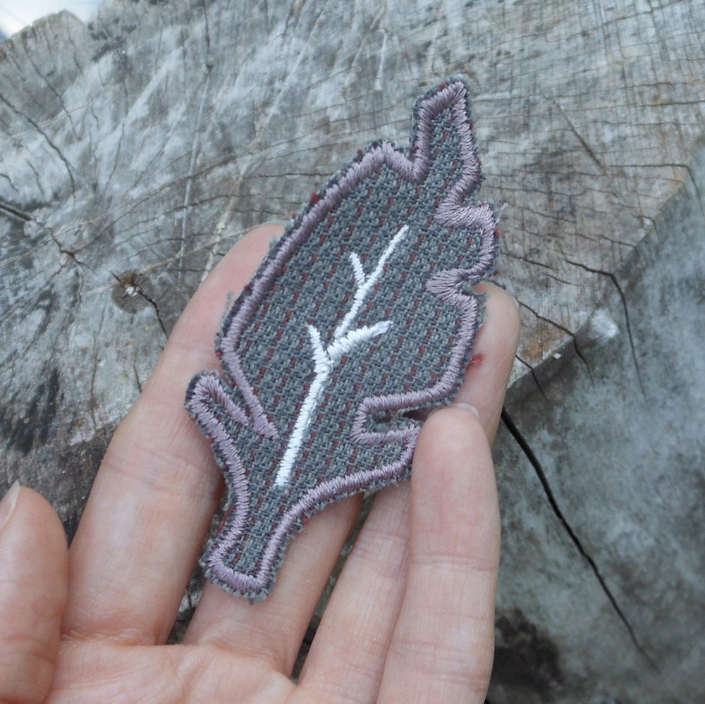 grey and rosy brown feather brooch