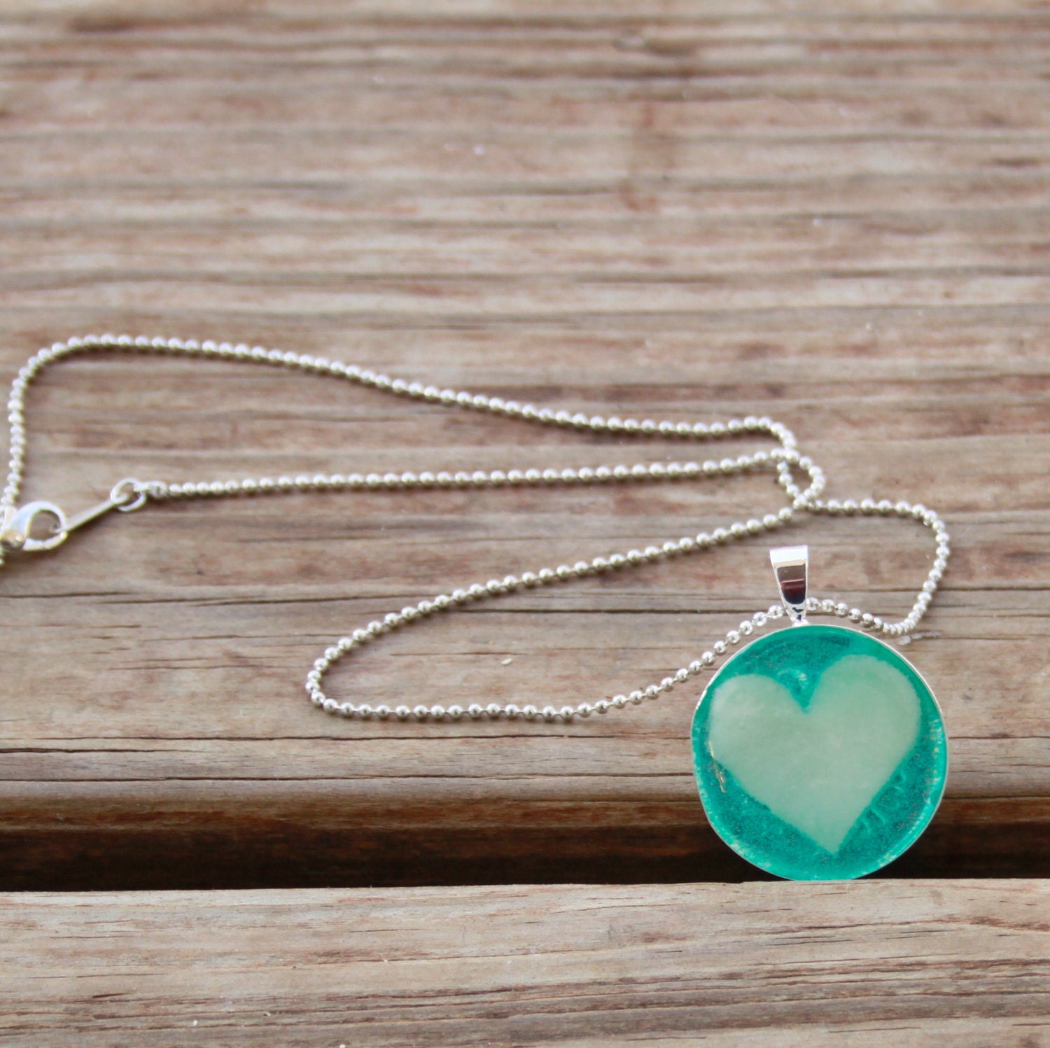 Breast Milk Pendant in Bezel Stamped Setting.