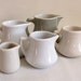 Set of 7 vintage pastel creamers