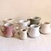 Set of 7 vintage pastel creamers