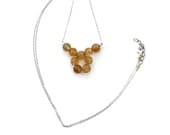 Faceted citrine long 9 stone necklace.