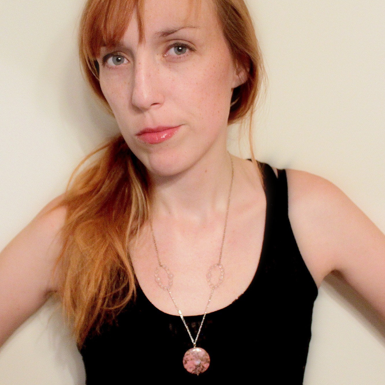 Pink rhodonite medallion necklace with rose quartz