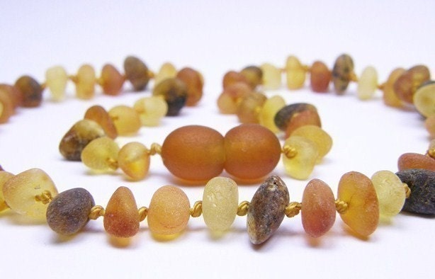 Raw Rounded beads Multicolored amber teething necklace for your baby.