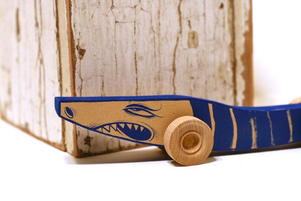 Acrylic hand painted wooden monster art toy on wheels