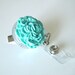 Retractable Badge Reel Turquoise Carnation on Clear Reel with Alligator Clip