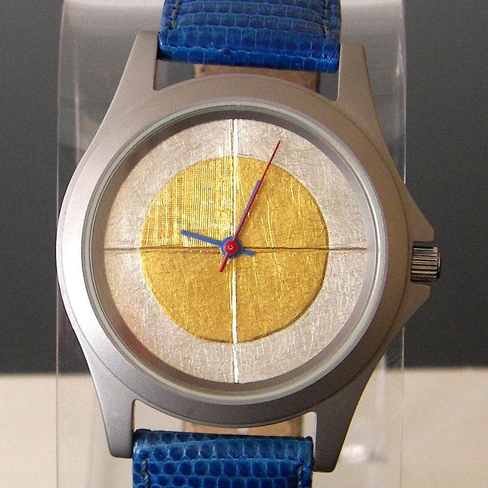 Watch with 24 karat gold and argentium silver