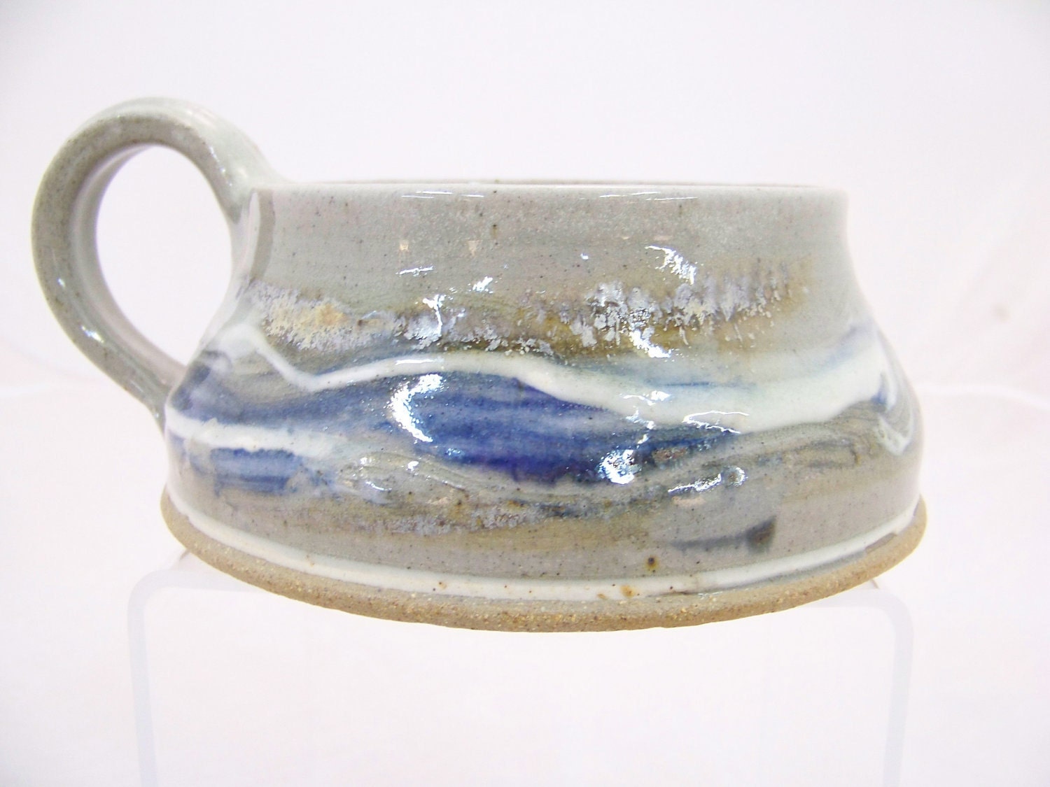 Hand-thrown Stoneware Soup Mug in a cobalt blue glaze with gold and white highlights.