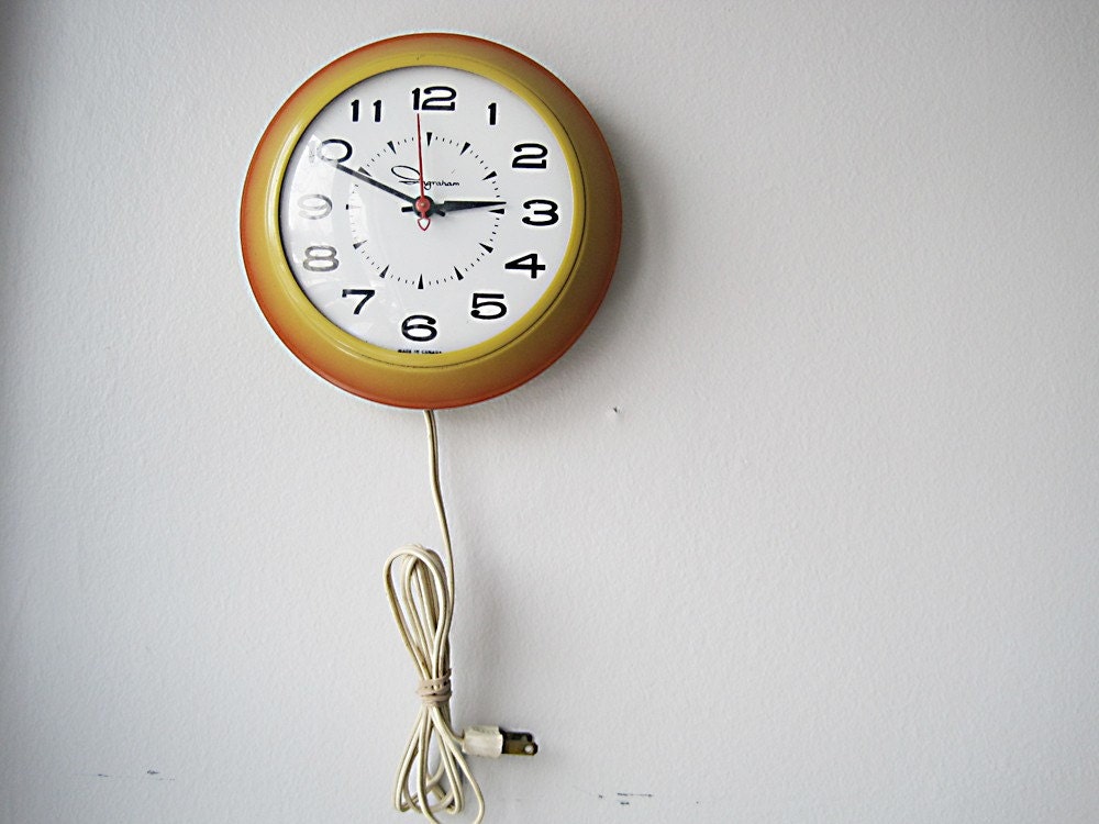 SALE vintage plug in wall clock in orange and by atouchofvintage