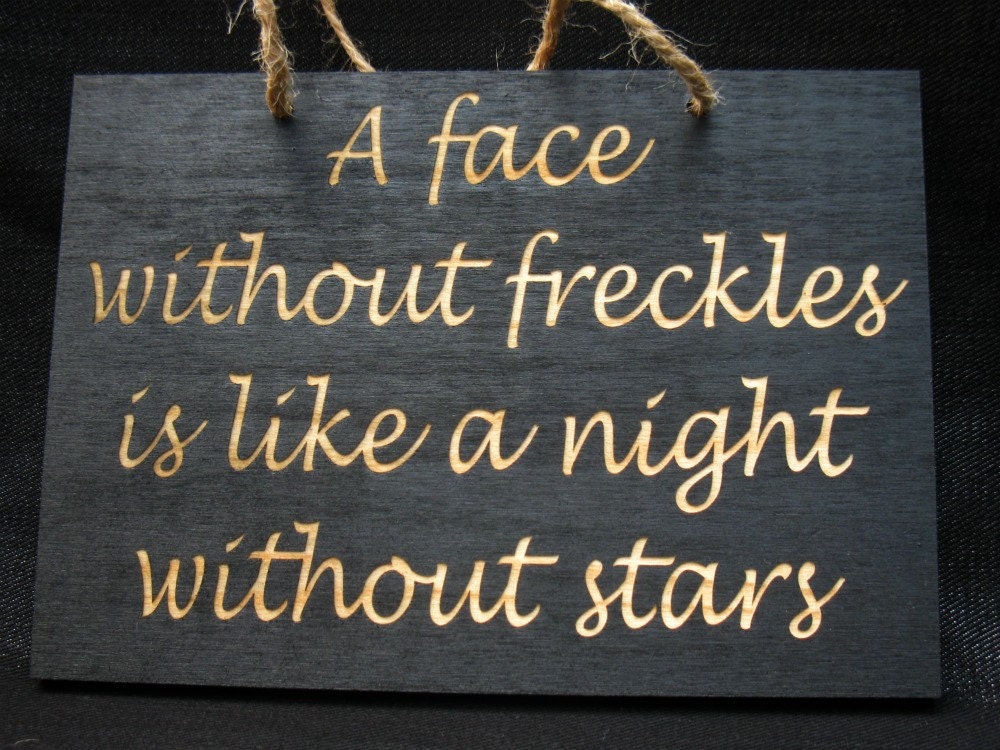 A face without freckles is like a night without stars wooden sign