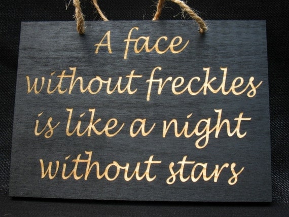 A face without freckles is like a night without stars wooden sign