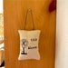 This Blows pillow door hanging