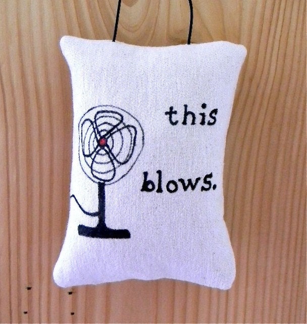 This Blows pillow door hanging