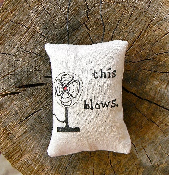 This Blows pillow door hanging