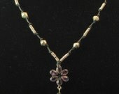 Necklace: Indian sterling and amethyst flower pendant with Ethiopian bicone and ring beads
